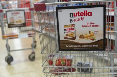advert signage that says "Trolleys" to indicate to customers where the trolley bay is